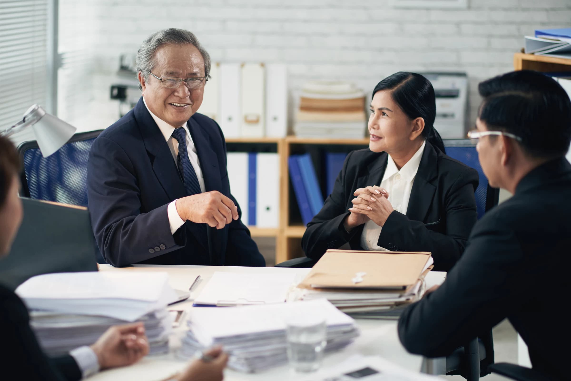 Advisors reviewing documents with a client