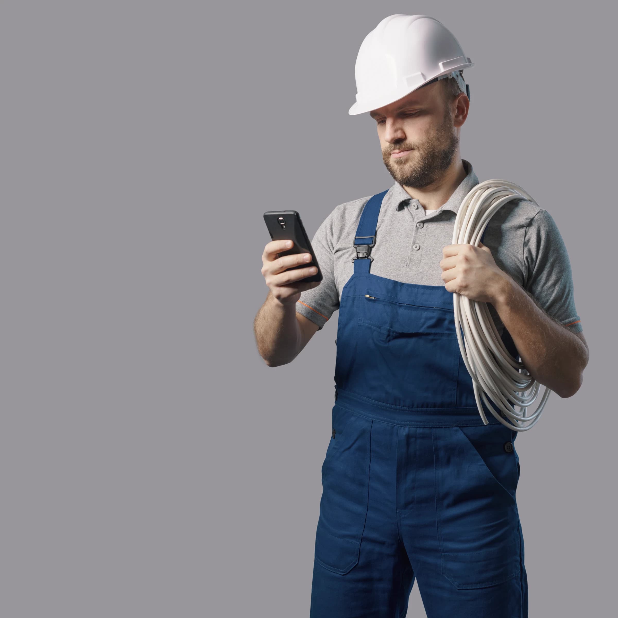 Electrician on the phone while handling cabling