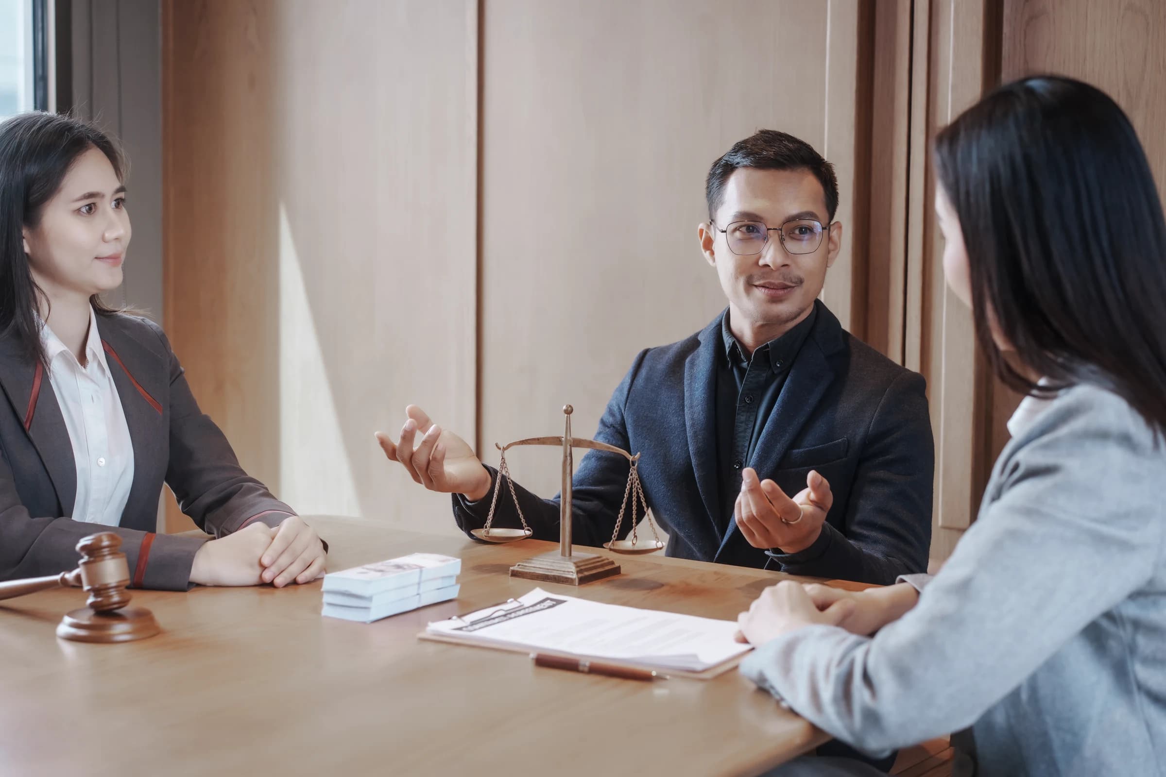 Lawyer consulting with clients